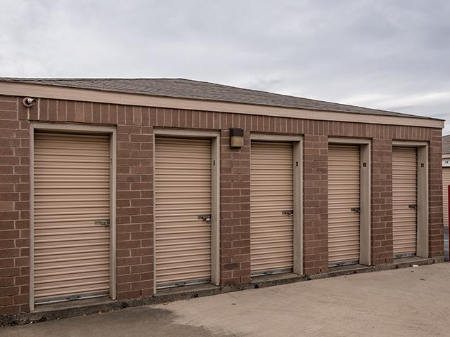 Affordable self storage units with orange doors at U-STOR SELF STORAGE