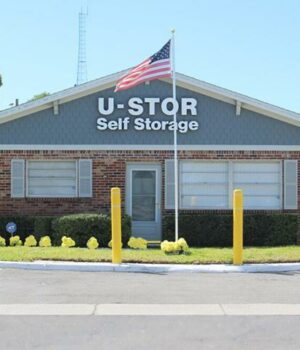 Large self storage building with rows of storage units and clear access lanes