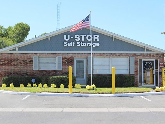 Large self storage building with rows of storage units and clear access lanes
