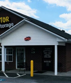 Friendly staff assisting customers at a self storage rental office